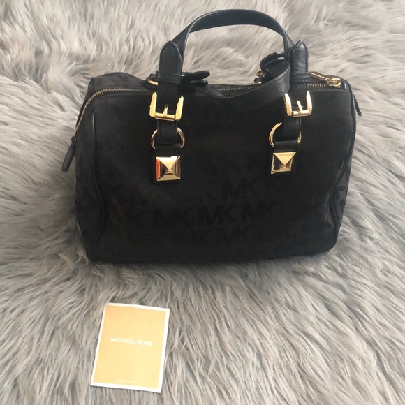 Michael Kors Handbags - Michael Kors black and gold purse